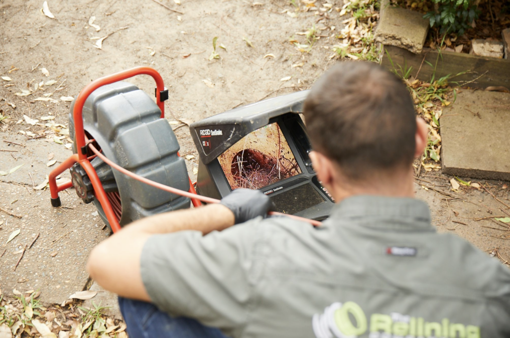 Employee working a machine to detect pipe